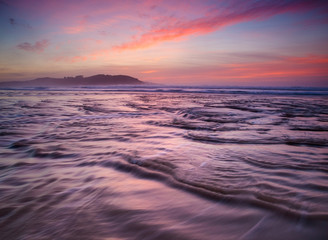 Fototapeta na wymiar Colorful sunset on the beach