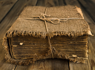 Old book wrapped in canvas - 60655008