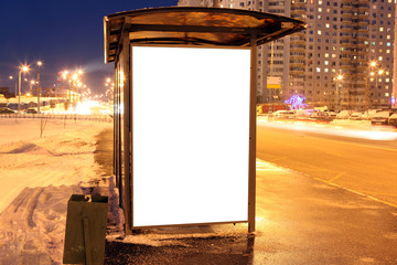 Blank sign at bus stop in city