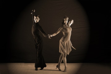dancers in ballroom isolated on black background