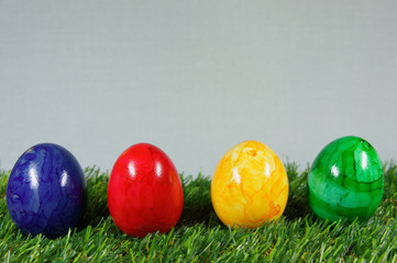 colorful easter eggs on a lawn of artificial green
