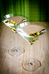 Two olive martini cocktails