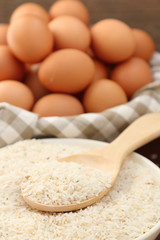 Fototapeta na wymiar Eggs and raw rice.