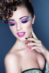 Beautiful young woman with professional party make up