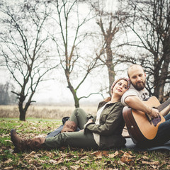 couple in love playing serenade with guitar