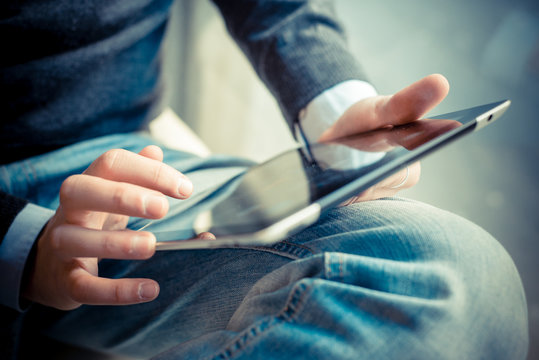 Close Up Hands Multitasking Man Using Tablet, Laptop And Cellhpo