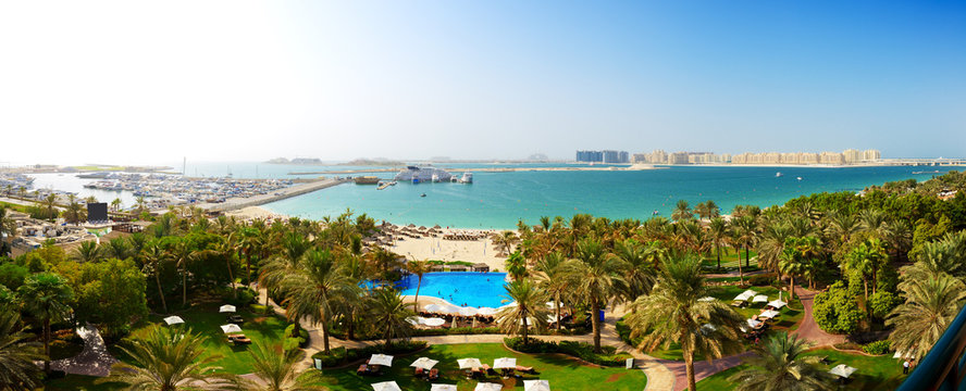 Panorama of beach with a view on Jumeirah Palm man-made island,