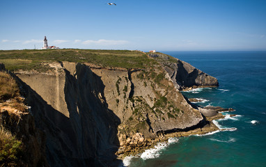 Fototapeta na wymiar Cape lighthouse and cliff