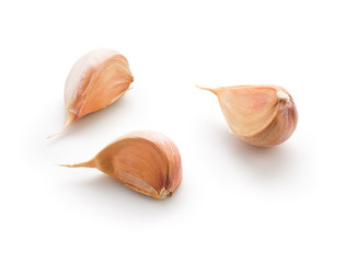 Garlic cloves on white background