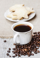Cup of coffee and stack of biscuits