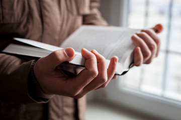 Man reading. Book in his hands.