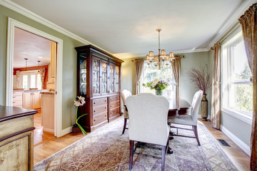 Olive and brown dining room with aristocratic furniture