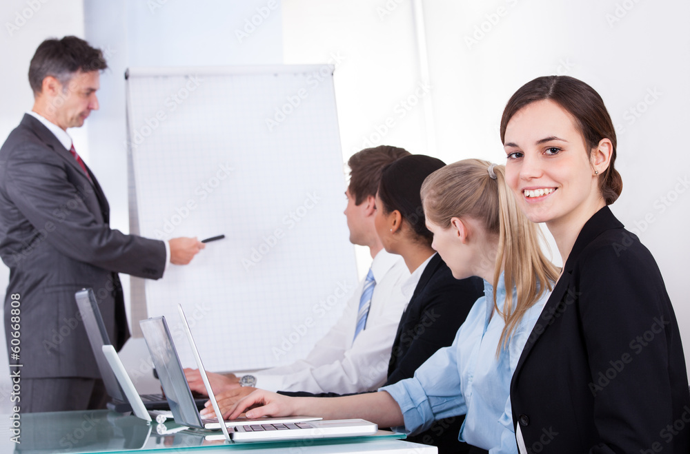 Wall mural Businessman Giving  Presentation To His Colleagues