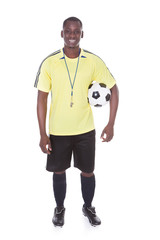 Football Player With A Soccer Ball