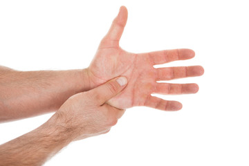 Person Pressing Palm With Thumb