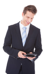 Businessman Using Calculator