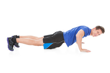 Obraz premium Young Man Doing Pushups