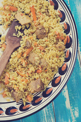 Above view of pilaf, uzbek traditional dish, vertical shot