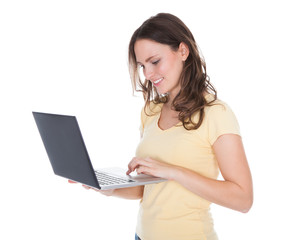 Naklejka premium Smiling Woman Using Laptop