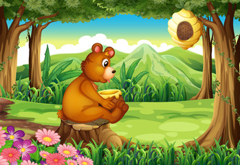 Obraz premium A bear at the forest near the beehive