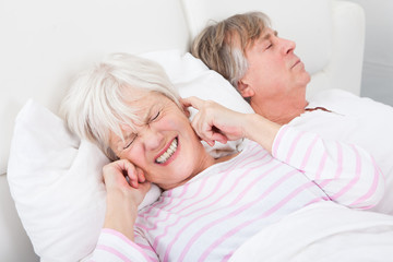 Woman Disturbed With Man Snoring
