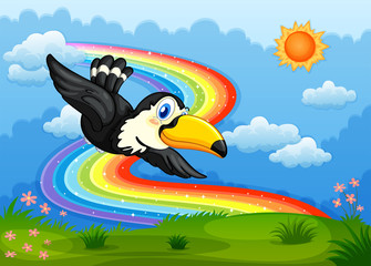 Obraz na płótnie Canvas A bird in the sky with a rainbow