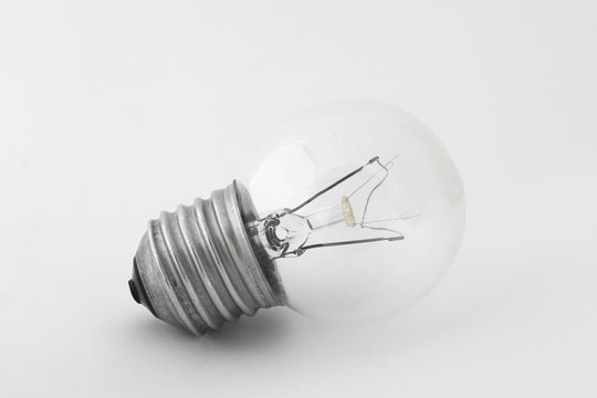 Light bulb in natural light on white background
