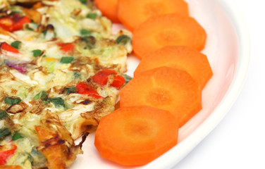 Fried egg sliced carrot as salad