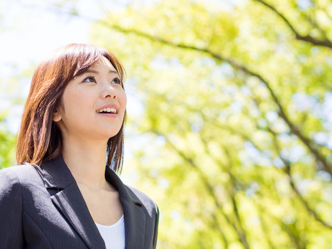 young asisn businesswoman in the park