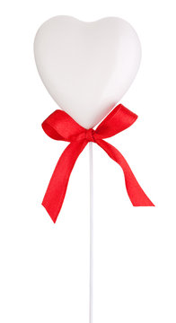 White heart and red ribbon with a bow Isolated on white backgrou