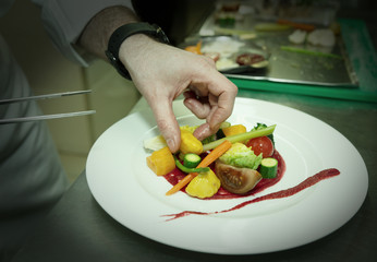 Chef is decorating appetizer