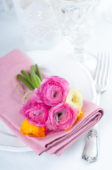 Festive table setting with flowers