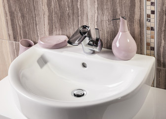 detail of a modern bathroom with sink and accessories
