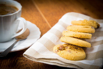 cup of tea with butter biscuits with chocolate chips