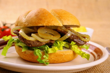 Ochsen Semmel - Grilled beef with onion rings in bun