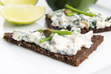 sandwiches with dark bread, herrings, mushrooms, pepper
