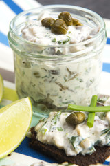 sandwiches with dark bread, herrings, mushrooms, pepper