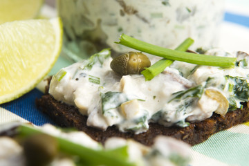 sandwiches with dark bread, herrings, mushrooms, pepper