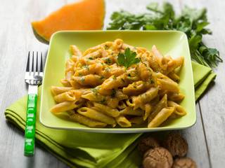 pasta with pumpkin sauce and parsley, selective focus