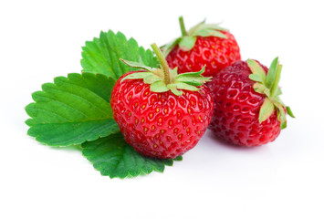 Strawberries with leaves. Isolated on a white background.