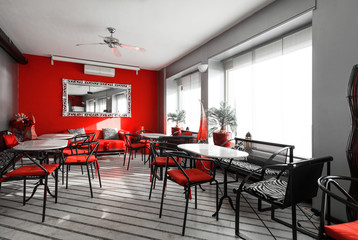 interior of a bar with red leather couch