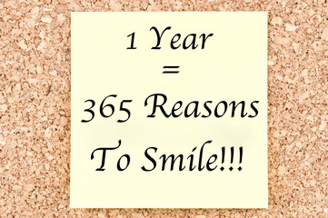 1 Year 365 Reasons To Smile, written on a sticky note