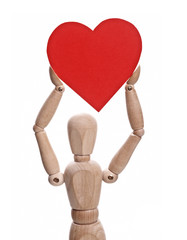 Wooden doll holds heart shaped paper