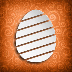 White shape of Easter egg on patterned background