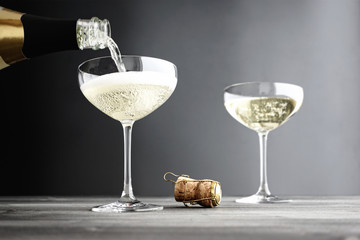 Champagne being filled in Coupe Glasses
