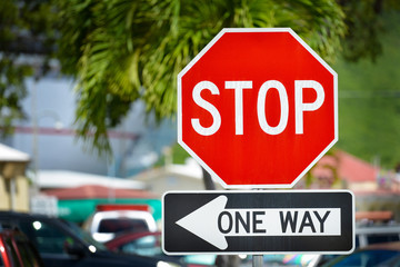 Stop and one way sign on a street