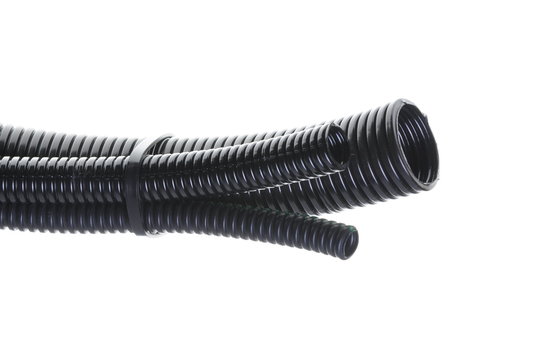 Black plastic corrugated pipe isolated on white background