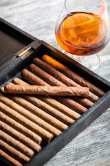 Humidor full of cigars and cognac