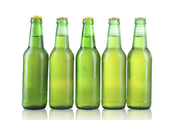 Bottles of beer with drops isolated