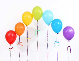 Rainbow of balloons isolated on white